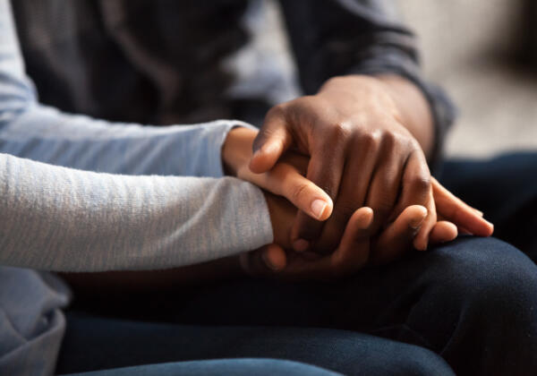 Close,up,black,woman,and,man,in,love,sitting,on